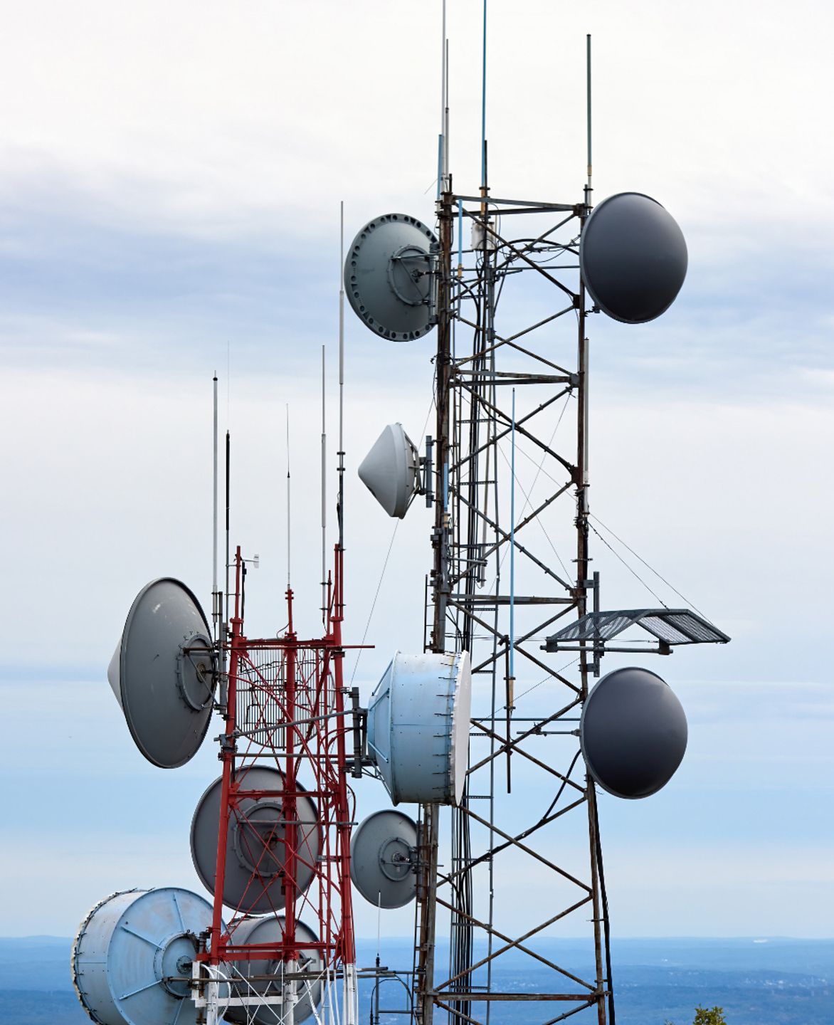 Broadcast towers with satellite dishes and antennas